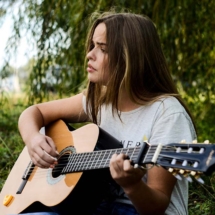 Lisa Elfrey playing guitar